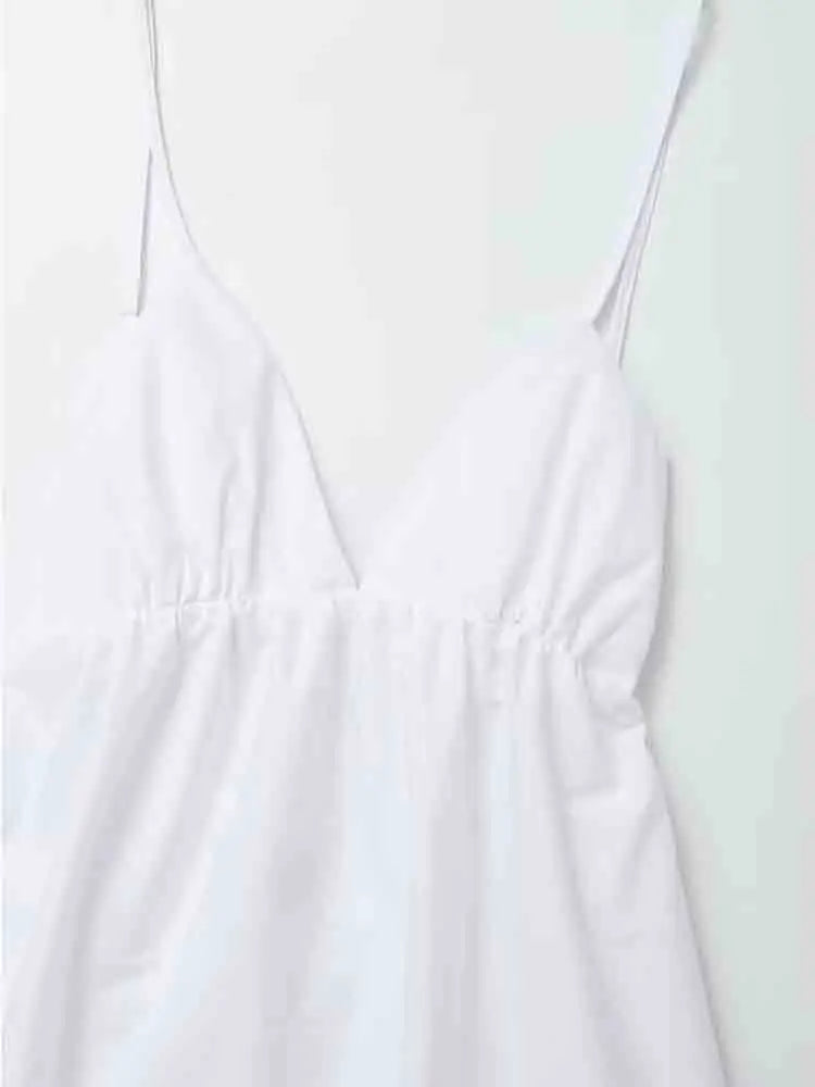 Biała sukienka midi na ramiączkach z dekoltem w kształcie litery V i odkrytymi plecami